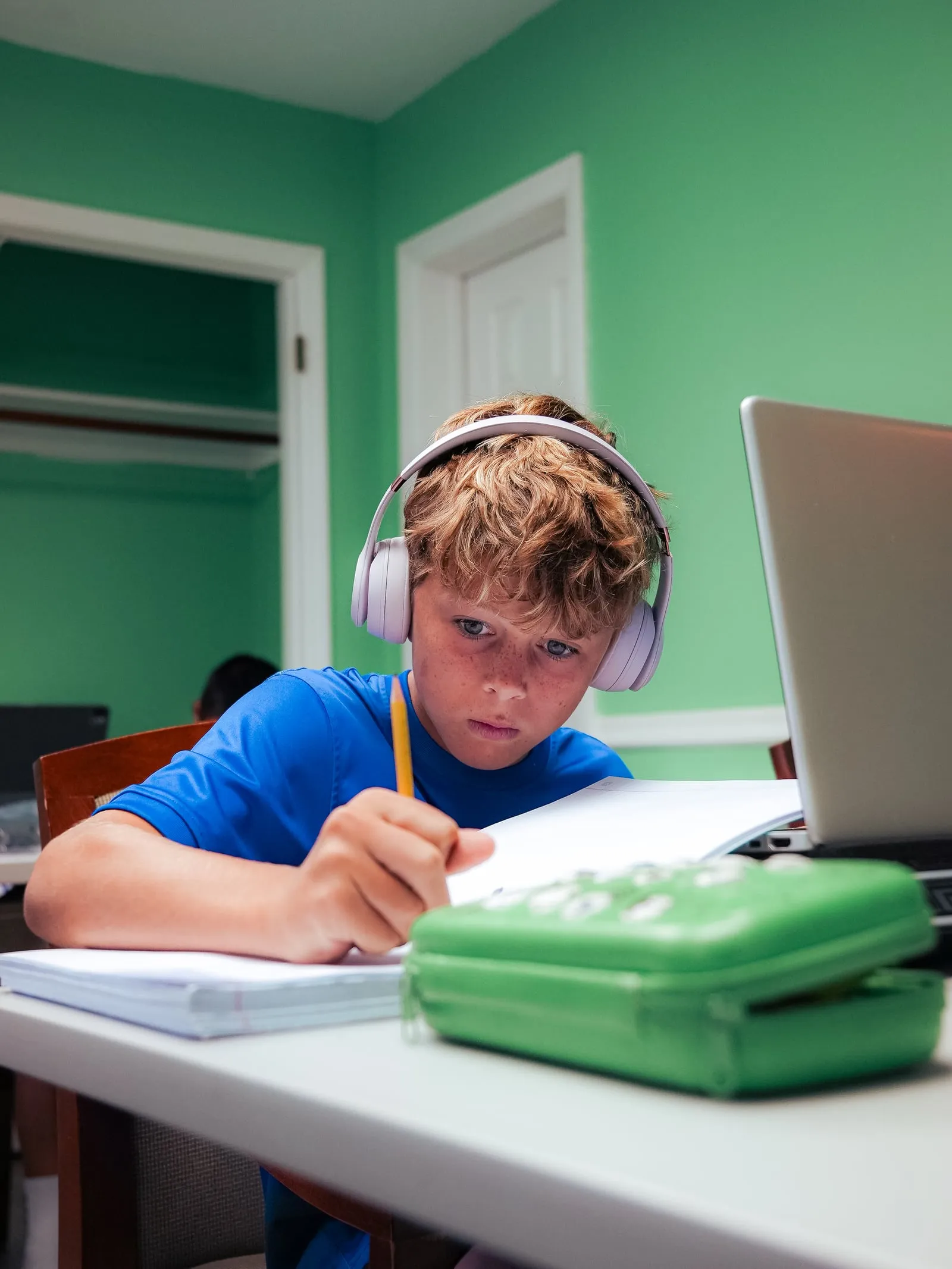 A player concentrating on written coursework in the learning lab
